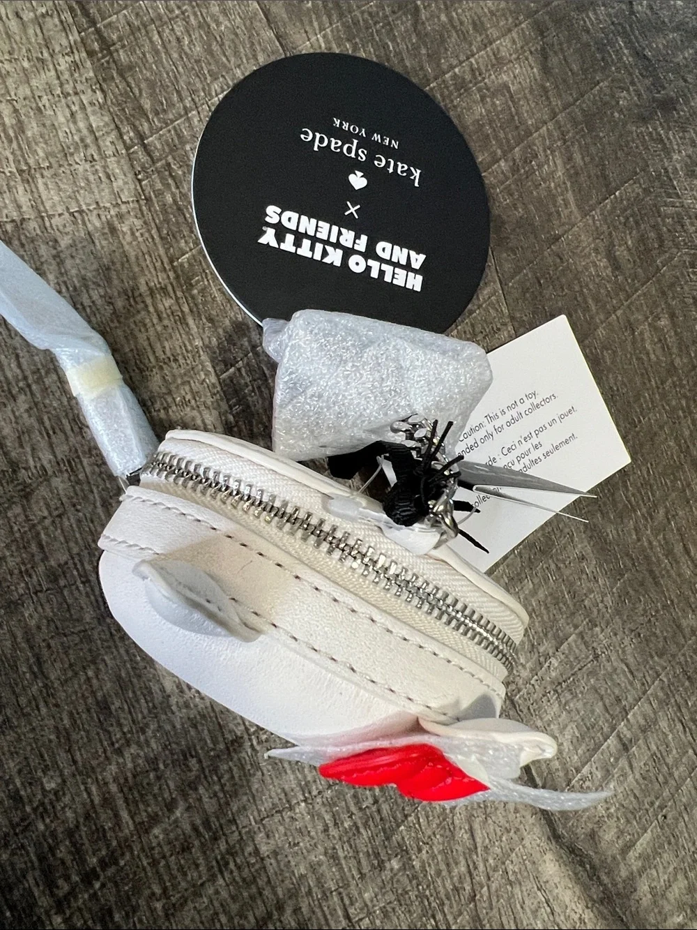 kate spade White Hello Kitty Coin Purse with Red Bow